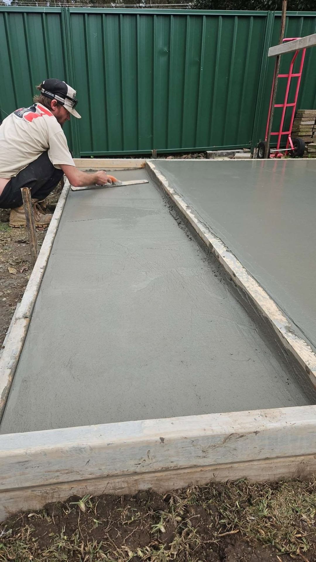 Jack Hodder finishing a fresh concrete slab in Taree